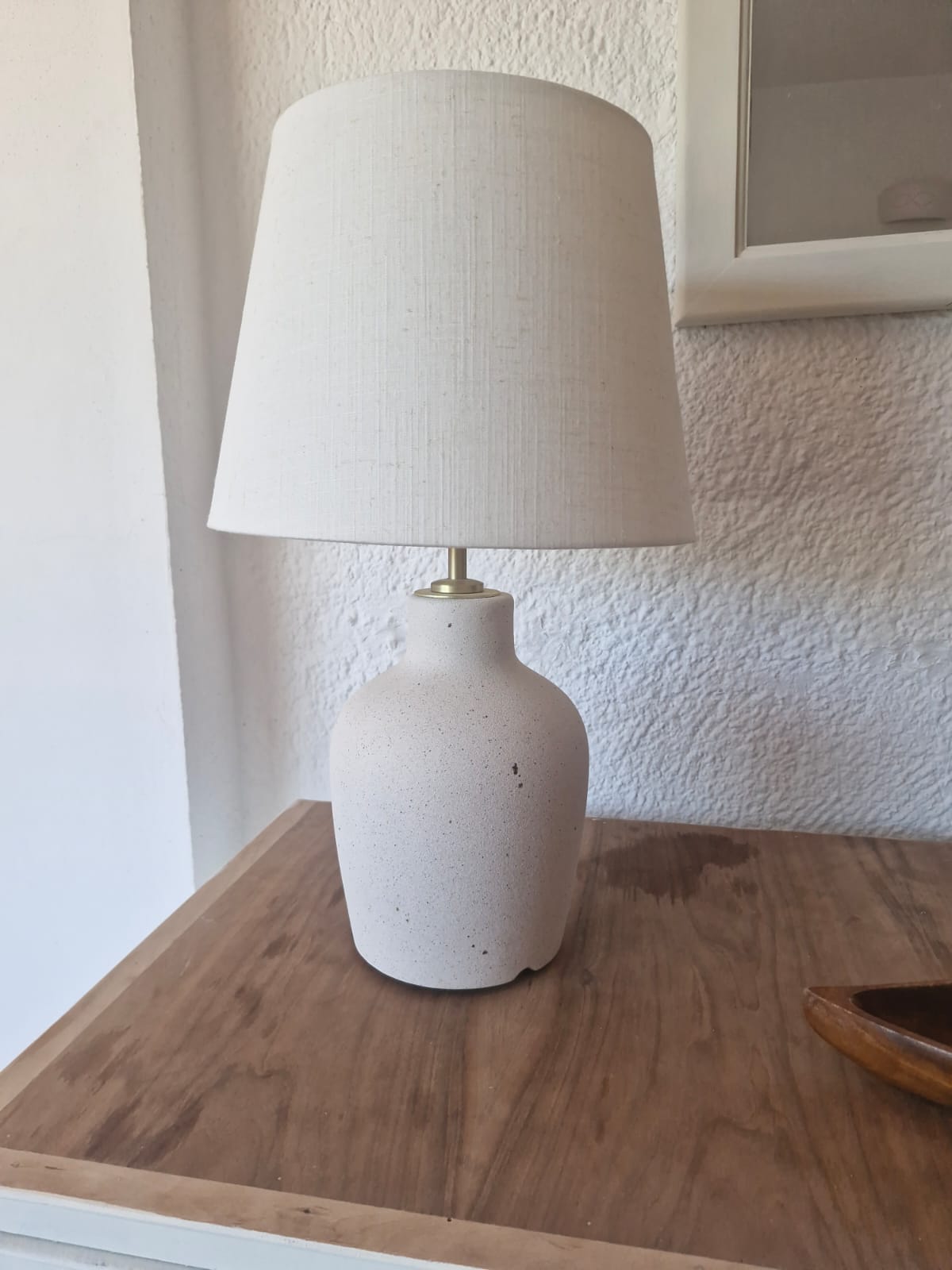 Ceramic table lamp on wooden side table